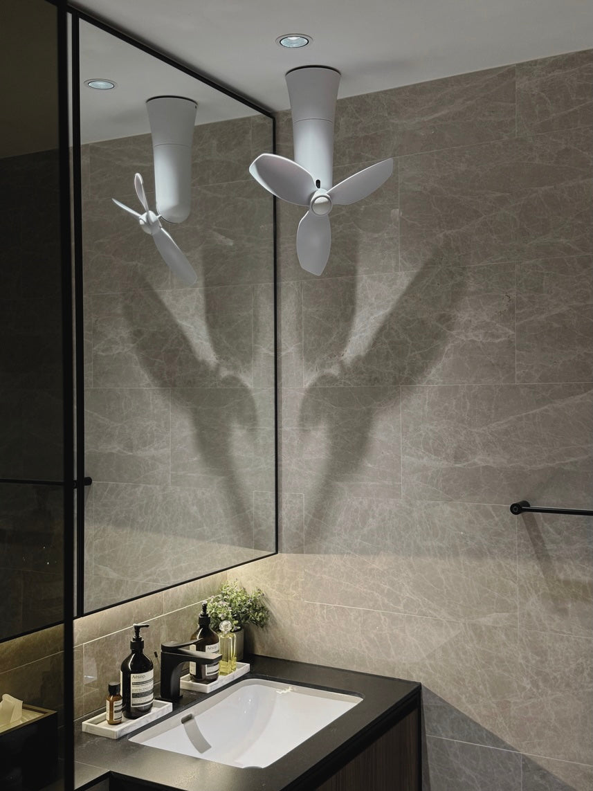 Spin quincy white ceiling mount corner fan installed in corner of bathroom